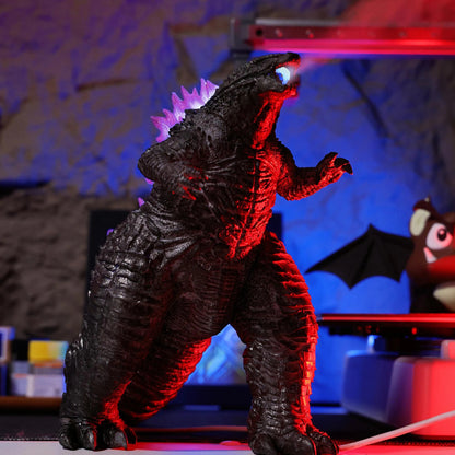 Mistzilla figure with purple glowing crystal dorsal fins in a dark room